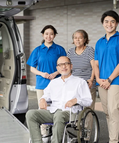 wheelchair-riding-elderly-and-caregivers-2025-03-14-11-19-31-utc